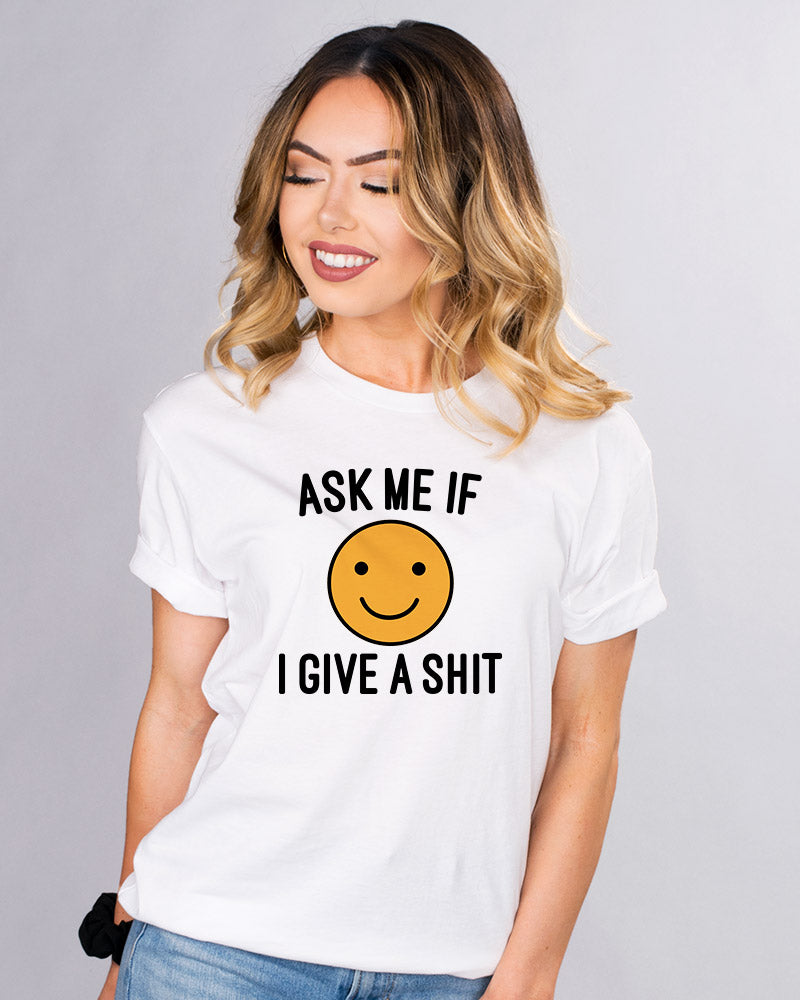 Ask Me if I Give Shirt - Femfetti - A white unisex fit graphic tee featuring the phrase &quot;Ask me if I give a shit&quot; with a smiley face.