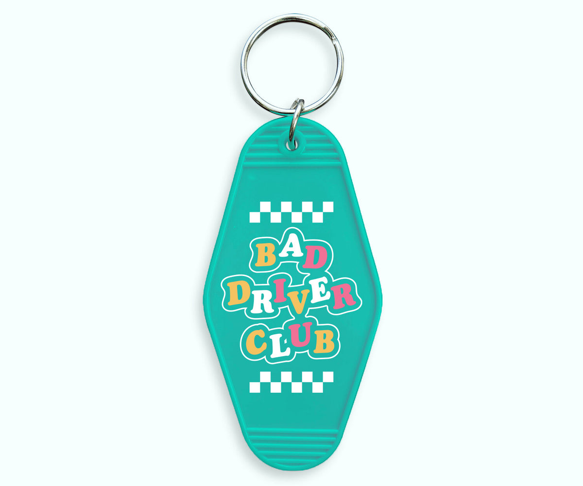 Bad Driver Club Motel Keychain - Femfetti - A turquoise acrylic motel style keychain featuring the phrase &quot;Bad Driver Club&quot;.