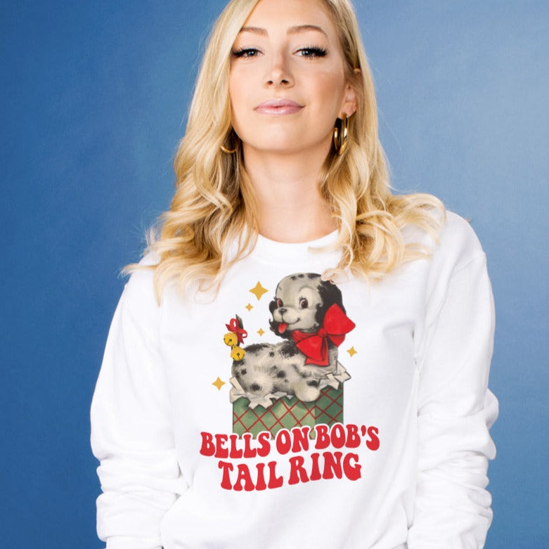 Bells on Bob&#39;s Tail Sweatshirt - Femfetti - A white unisex fit graphic crewneck sweatshirt featuring the phrase &quot;Bells on Bob&#39;s Tail Ring&quot; with an image of a dog.