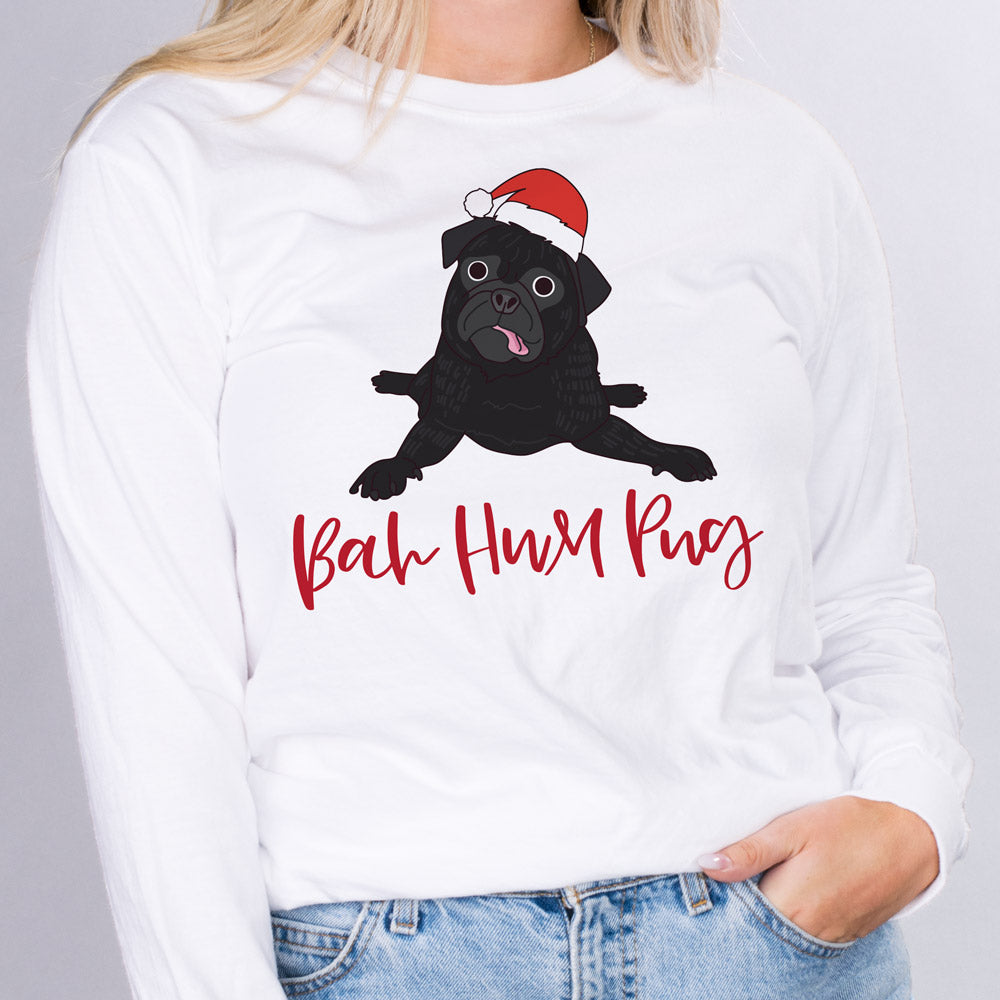 Bah Hum Pug Long Sleeve Shirt - Femfetti - A white unisex fit graphic long sleeve shirt featuring the phrase &quot;Bah Hum Pug&quot; with an image of a pug in a santa hat.