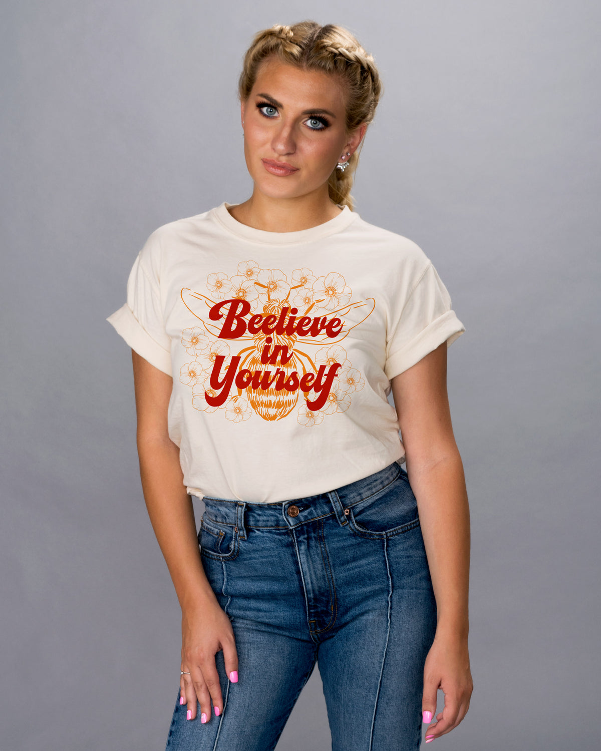 Bee-lieve in Yourself Shirt - Femfetti - An ivory color unisex fit graphic tee featuring the phrase &quot;bee-live in yourself&quot; with the image of a bee.