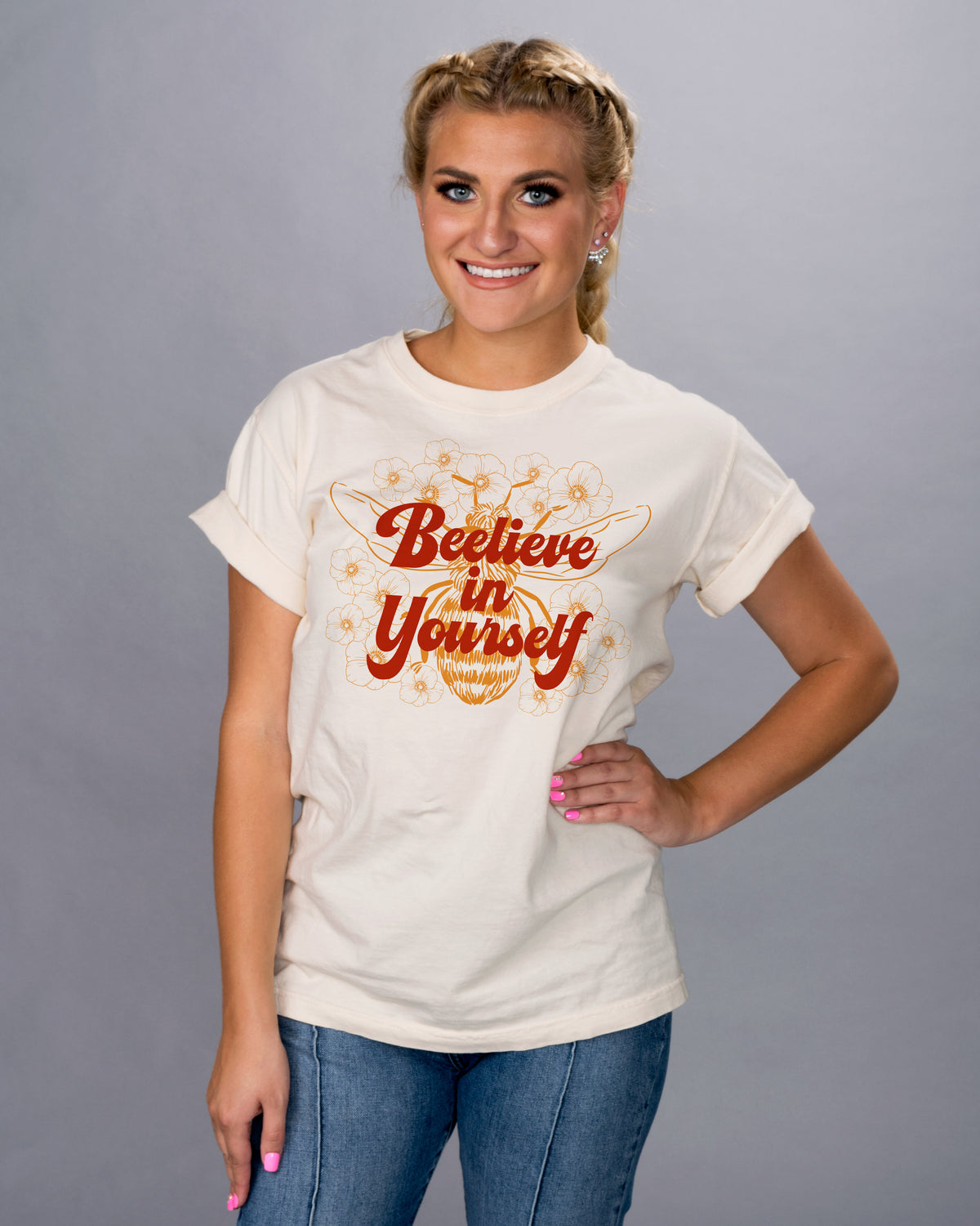 Bee-lieve in Yourself Shirt - Femfetti - An ivory color unisex fit graphic tee featuring the phrase &quot;bee-live in yourself&quot; with the image of a bee.