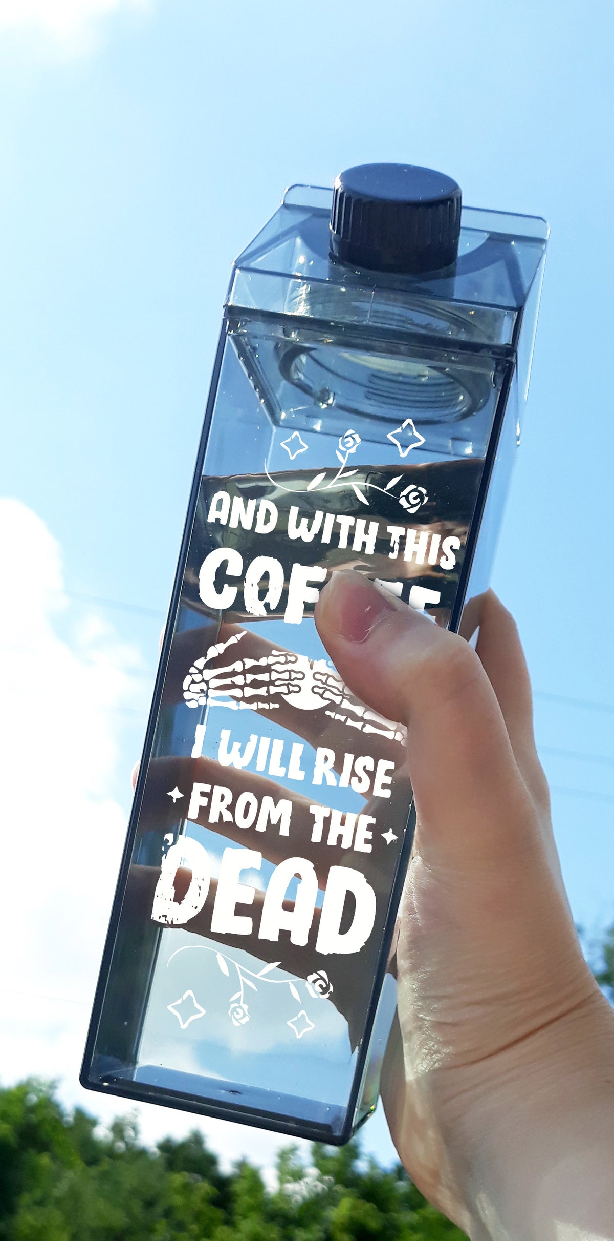 And With This Coffee Milk Carton Water Bottle - Femfetti - A black milk carton shaped water bottle with the phrase &quot;And with this coffee I will rise from the dead&quot; in white text.